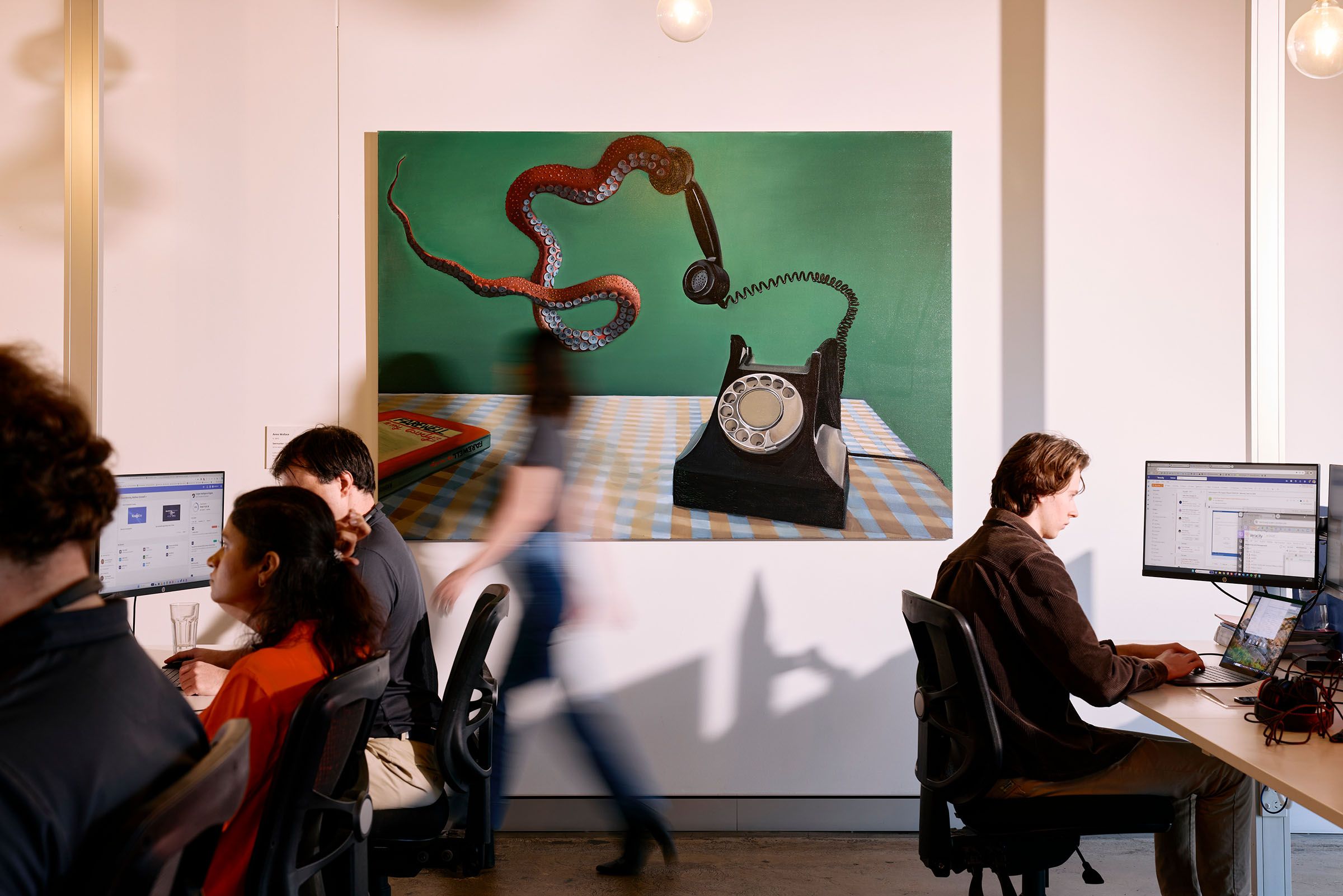 Top digital experience agencies in London office environment with creative artwork.