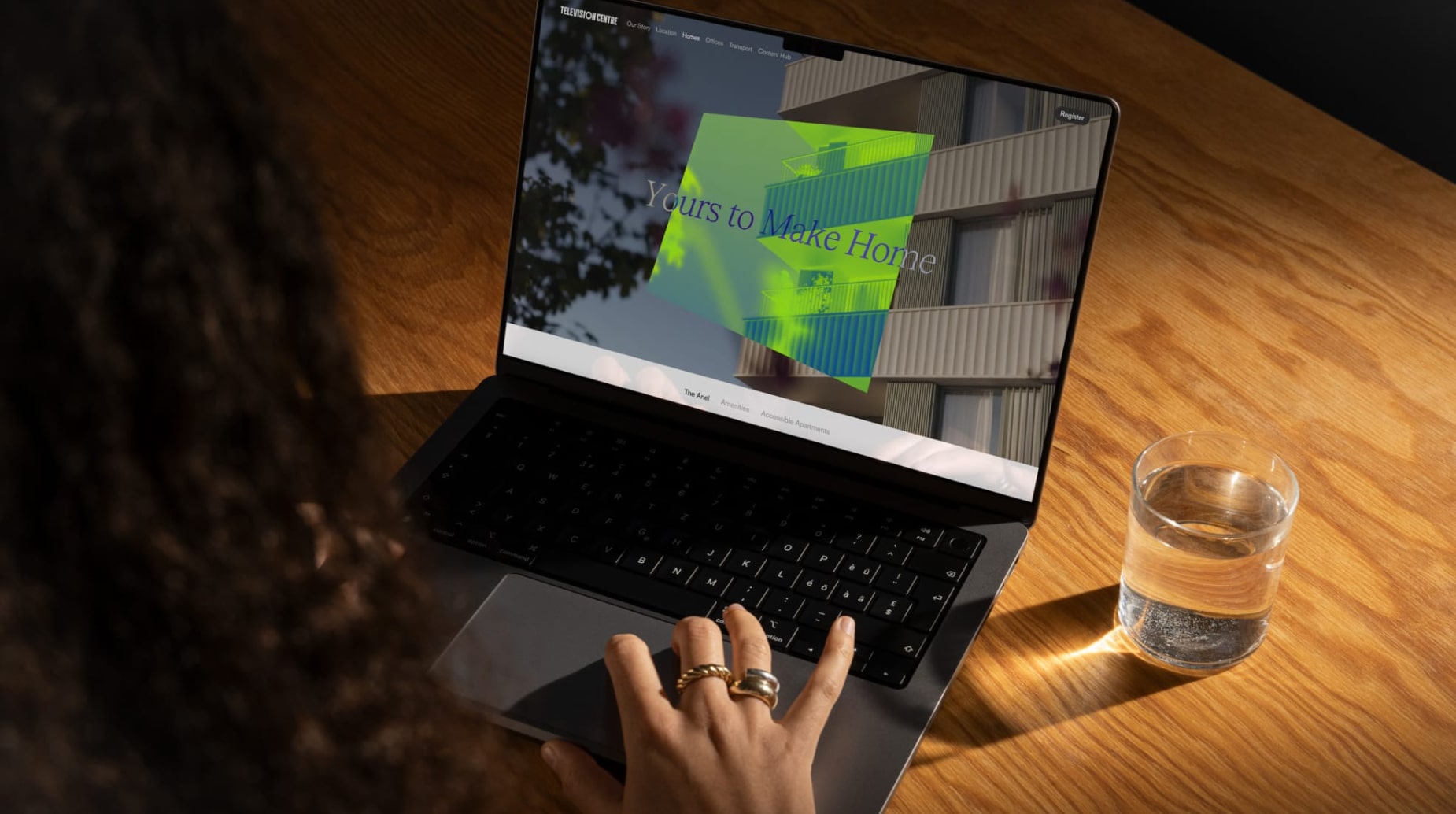 Person using laptop while researching the best web development agency in the UK.