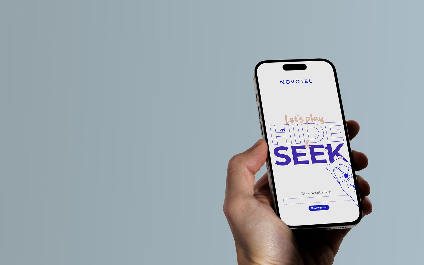 Person holding a smartphone with a playful Hide and Seek game interface, representing one of the best web development agencies in London.